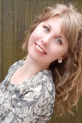 Ukrainian mail order bride Oksana from Nikolaev with blonde hair and blue eye color - image 1