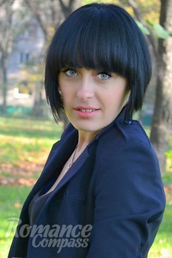 Ukrainian mail order bride Olga from Zaporozhye with black hair and green eye color - image 1