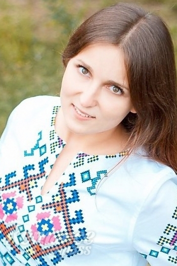 Ukrainian mail order bride Alena from Poltava with light brown hair and green eye color - image 1