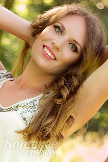 Ukrainian mail order bride Daria from Sumy with light brown hair and blue eye color - image 1