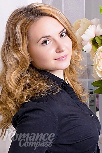 Ukrainian mail order bride Anastasia from Kharkiv with light brown hair and brown eye color - image 1