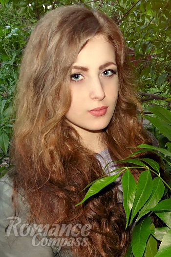 Ukrainian mail order bride Victoria from Nikolaev with light brown hair and blue eye color - image 1