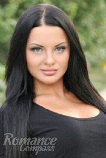 Ukrainian girl Anna,32 years old with blue eyes and black hair.
