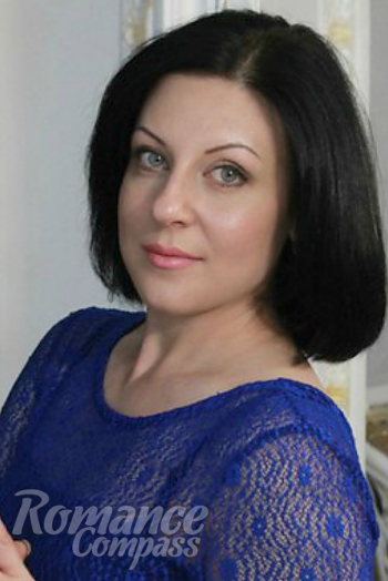 Ukrainian mail order bride Eugenua from Nikolaev with black hair and green eye color - image 1