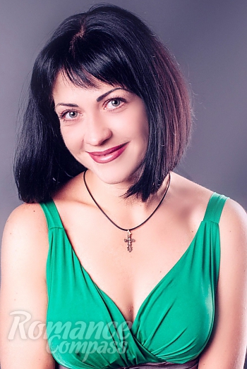 Ukrainian mail order bride Anna from Poltava with black hair and green eye color - image 1