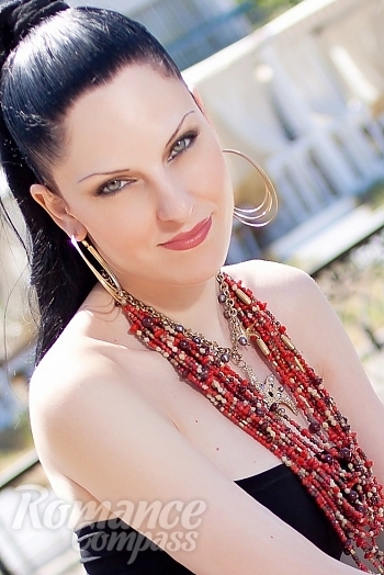 Ukrainian mail order bride Yulia from Nikolaev with black hair and green eye color - image 1