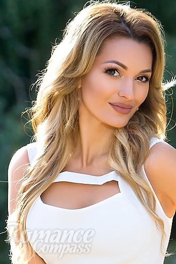 Ukrainian mail order bride Oksana from Odessa with light brown hair and hazel eye color - image 1