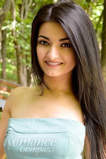 Ukrainian mail order bride Liana from Poltava with black hair and brown eye color - image 1