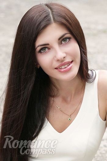 Ukrainian mail order bride Mariya from Nikopol with black hair and green eye color - image 1
