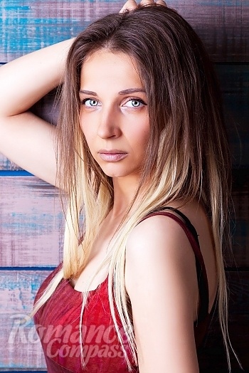Ukrainian mail order bride Oksana from Kharkiv with light brown hair and blue eye color - image 1