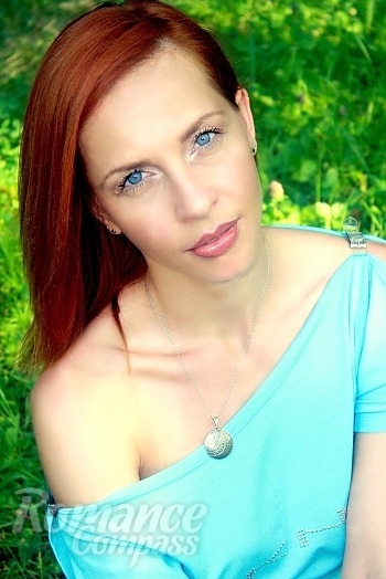 Ukrainian mail order bride Yulia from Kiev with red hair and blue eye color - image 1