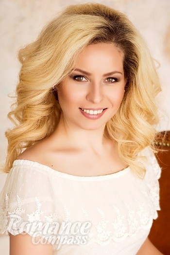 Ukrainian mail order bride Julia from Kyiv with blonde hair and green eye color - image 1