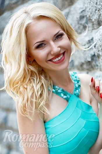 Ukrainian mail order bride Oksana from Kiev with blonde hair and green eye color - image 1