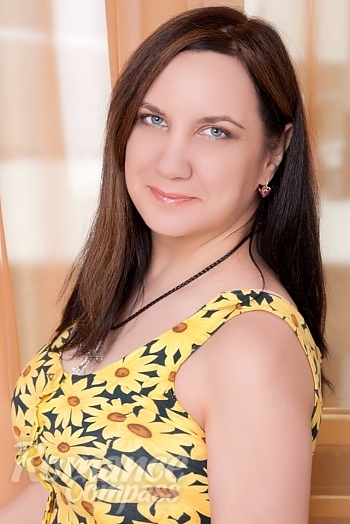 Ukrainian mail order bride Tanya from Kharkov with brunette hair and blue eye color - image 1
