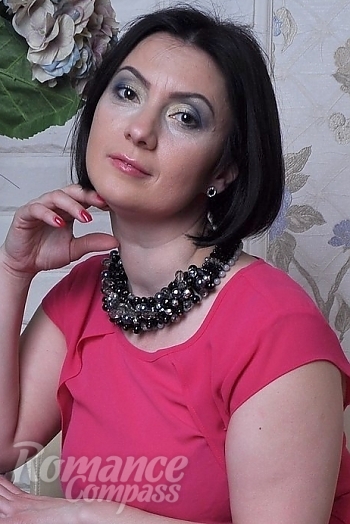 Ukrainian mail order bride Natela from Kharkov with black hair and black eye color - image 1