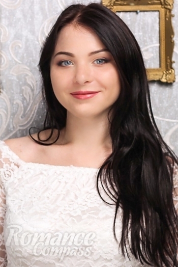 Ukrainian mail order bride Oksana from Kharkov with black hair and green eye color - image 1