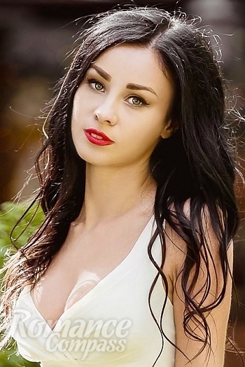 Ukrainian mail order bride Juliya from Odessa with black hair and green eye color - image 1