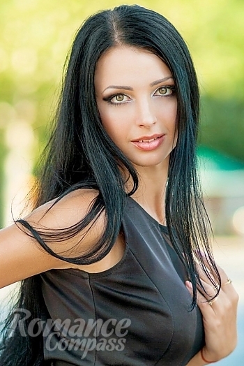 Ukrainian mail order bride Irina from Odessa with black hair and green eye color - image 1