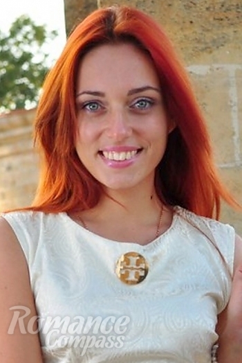 Ukrainian mail order bride Yana from Odessa with red hair and green eye color - image 1