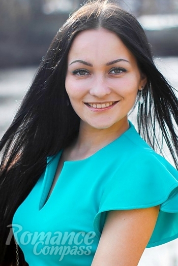 Ukrainian mail order bride Ludmila from Poltava with black hair and green eye color - image 1