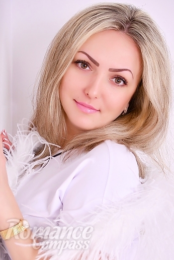 Ukrainian mail order bride Oksana from Zhytomyr with blonde hair and hazel eye color - image 1