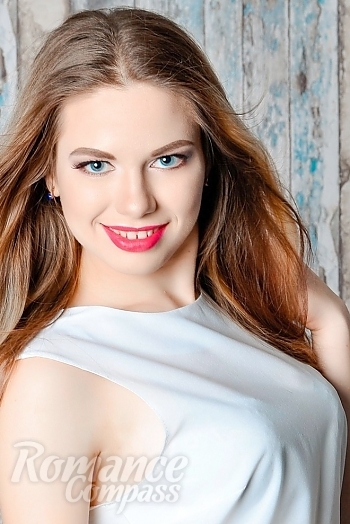 Ukrainian mail order bride Alina from Kharkov with light brown hair and blue eye color - image 1