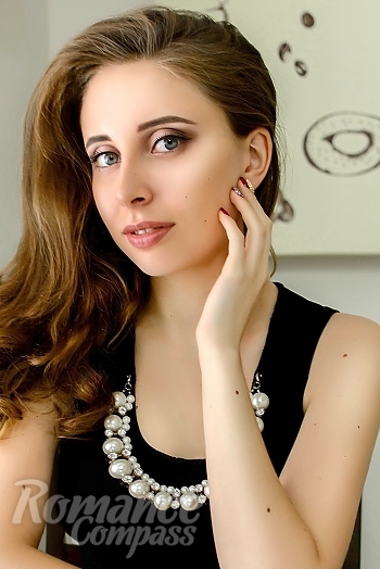 Ukrainian mail order bride Oksana from Zhytomyr with light brown hair and blue eye color - image 1