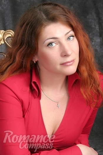Ukrainian mail order bride Olga from Kharkov with red hair and hazel eye color - image 1