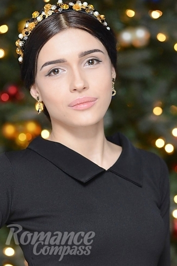 Ukrainian mail order bride Torika from Melitopol with black hair and hazel eye color - image 1
