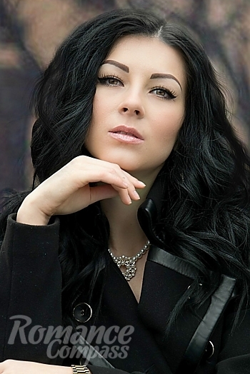 Ukrainian mail order bride Svetlana from Kharkiv with black hair and green eye color - image 1