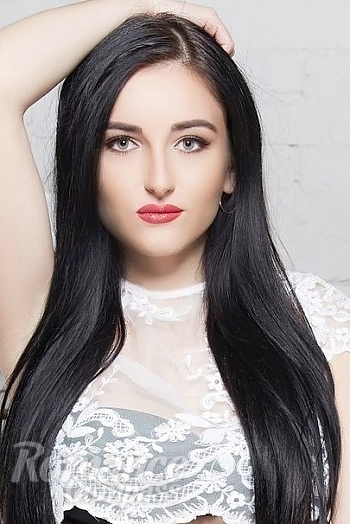 Ukrainian mail order bride Irina from Kiev with black hair and green eye color - image 1