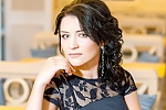 Ukrainian mail order bride Oksana from Krivoy Rog with black hair and green eye color - image 4