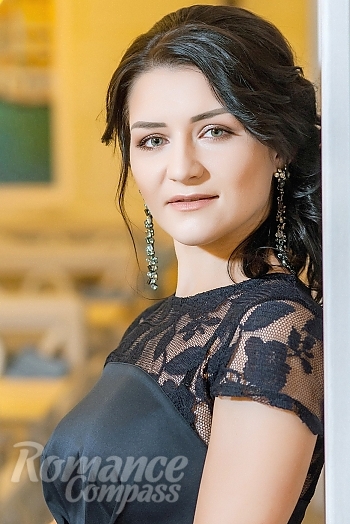 Ukrainian mail order bride Oksana from Krivoy Rog with black hair and green eye color - image 1