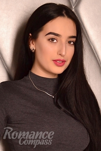 Ukrainian mail order bride Anna from Kyiv with black hair and brown eye color - image 1
