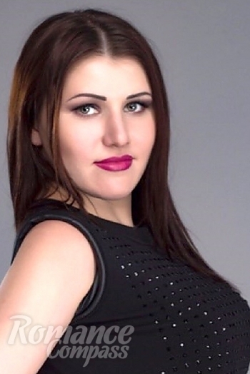 Ukrainian mail order bride Olga from Nikolaev with light brown hair and green eye color - image 1