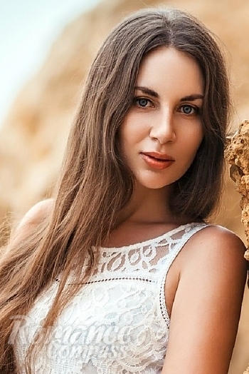Ukrainian mail order bride Evgeniya from Yalta with black hair and blue eye color - image 1