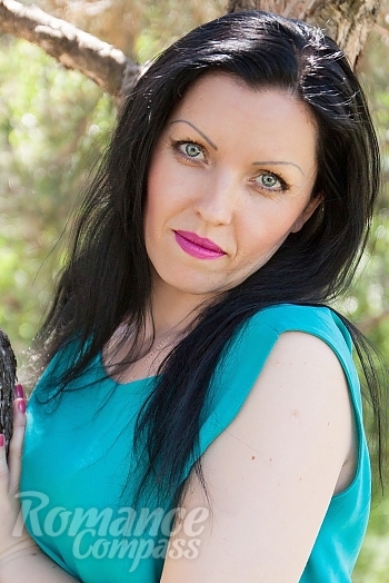 Ukrainian mail order bride Anna from Nikolaev with black hair and blue eye color - image 1