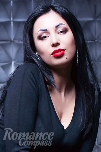 Ukrainian mail order bride Alina from Donetsk with black hair and green eye color - image 1