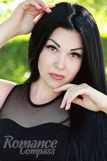 Ukrainian mail order bride Yana from Nikopol with black hair and brown eye color - image 1