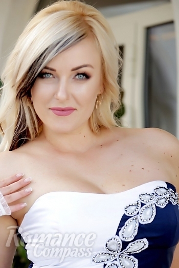 Ukrainian mail order bride Lyudmila from Kherson with blonde hair and blue eye color - image 1
