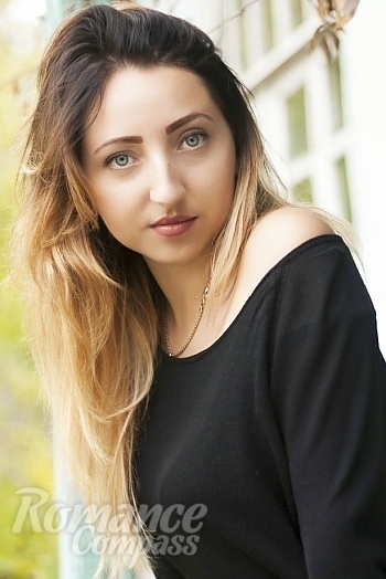 Ukrainian mail order bride Anna from Berdiansk with light brown hair and green eye color - image 1
