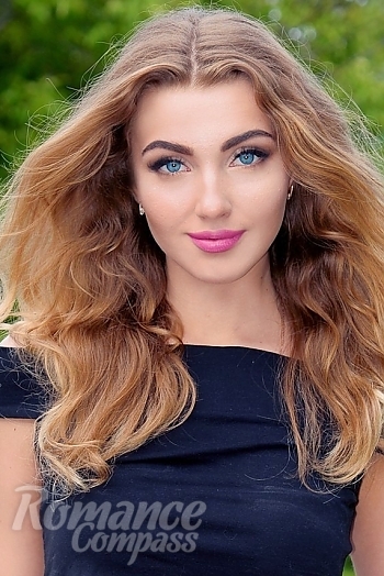 Ukrainian mail order bride Polina from Kharkov with light brown hair and blue eye color - image 1