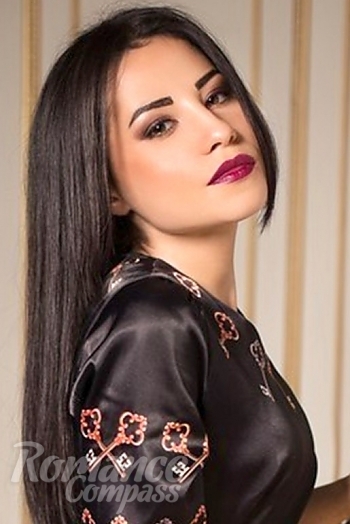 Ukrainian mail order bride Irina from Donetsk with black hair and green eye color - image 1
