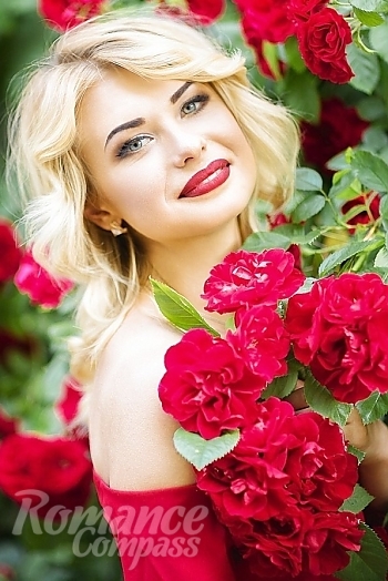 Ukrainian mail order bride Olga from Nikolaev with blonde hair and green eye color - image 1