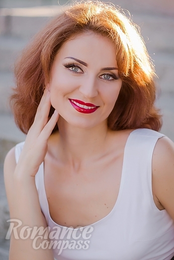 Ukrainian mail order bride Ludmila from Nikopol with light brown hair and blue eye color - image 1