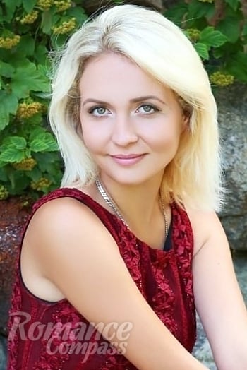 Ukrainian mail order bride Yana from Romny with blonde hair and hazel eye color - image 1