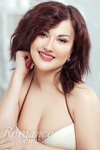 Ukrainian mail order bride Nadezhda from Dnipro with black hair and hazel eye color - image 1