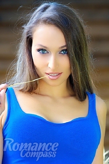 Ukrainian mail order bride Elena from Sumy with light brown hair and green eye color - image 1