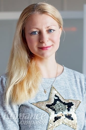 Ukrainian mail order bride Svetlana from Kiev with blonde hair and blue eye color - image 1
