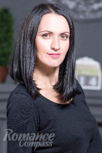 Ukrainian mail order bride Anna from Nikolaev with black hair and green eye color - image 1